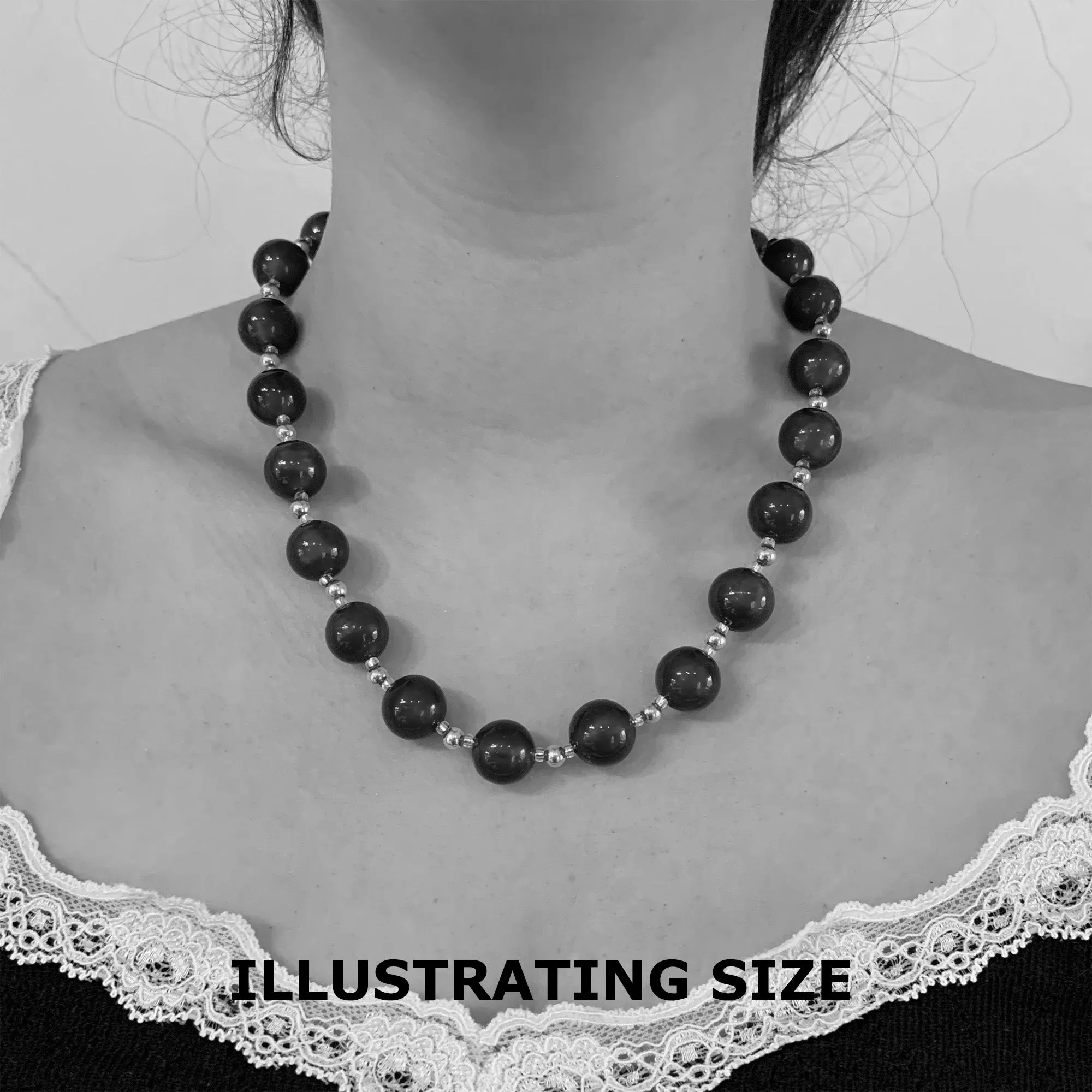 Necklace with black appliqué over white gold Murano glass sphere beads on silver